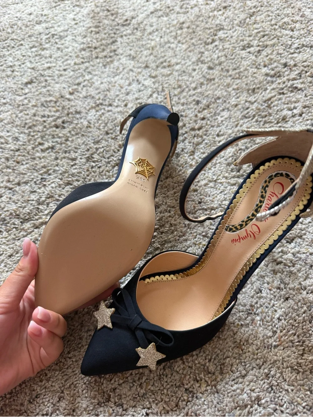 Charlotte Olympia Black Pointed-Toe Ankle-Strap Heels with Gold Star Accents